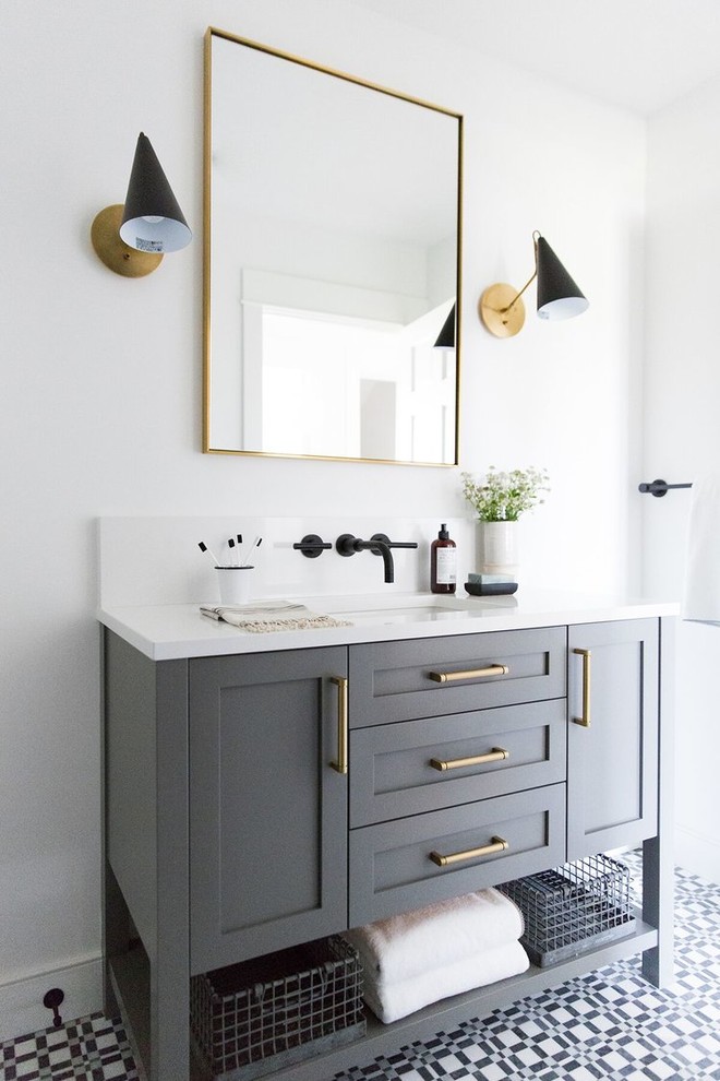 Mid-sized transitional kids bathroom in Salt Lake City with grey cabinets, white walls, ceramic floors, an undermount sink, white benchtops, shaker cabinets and multi-coloured floor.