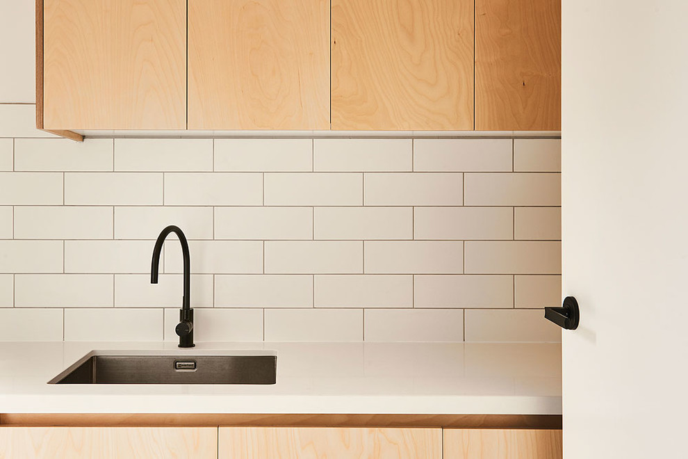 This is an example of a beach style laundry room in Geelong.