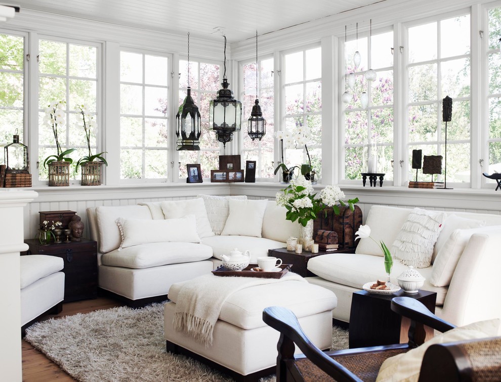 Photo of a mid-sized eclectic sunroom in Stockholm with dark hardwood floors, a standard ceiling and no fireplace.