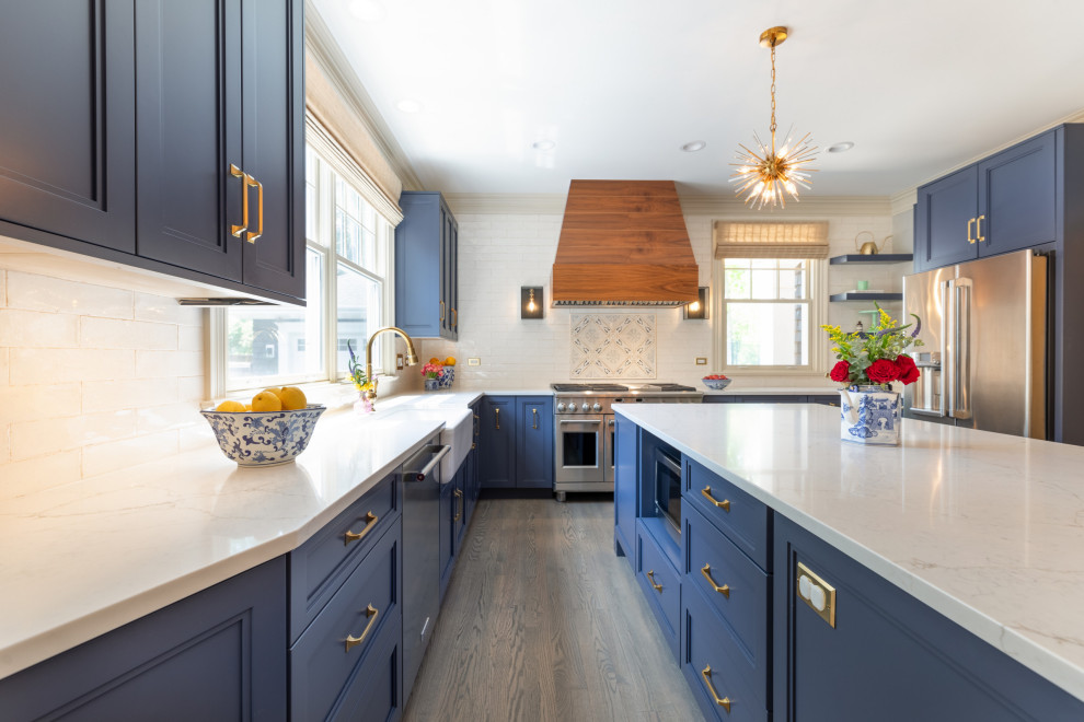 Navy & Walnut Kitchen With Gold Accents and Statement Lighting