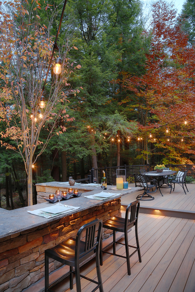 Mid-sized eclectic backyard outdoor kitchen deck photo with no cover