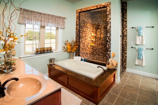Inspiration for a mid-sized traditional master bathroom in Other with medium wood cabinets, an alcove shower, beige tile, brown tile, white tile, mosaic tile, blue walls, an integrated sink and solid surface benchtops.