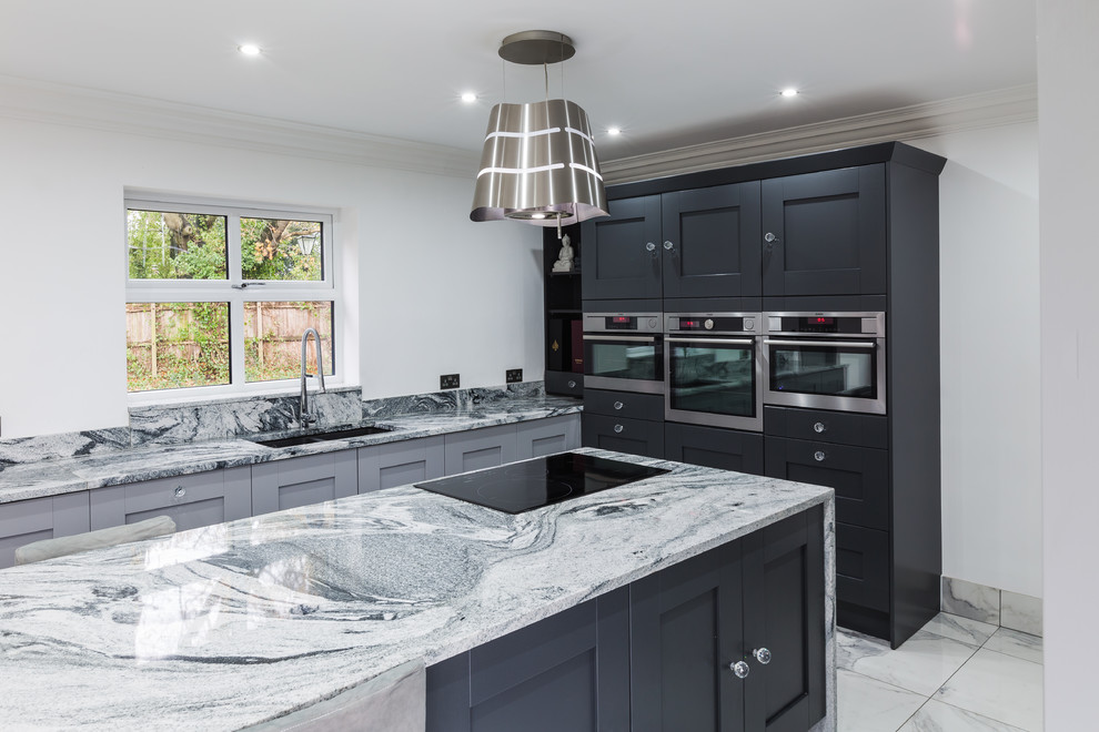 Design ideas for an expansive modern eat-in kitchen in Other with a double-bowl sink, black cabinets, granite benchtops, multi-coloured splashback, stone tile splashback, black appliances, marble floors, with island, multi-coloured floor and multi-coloured benchtop.