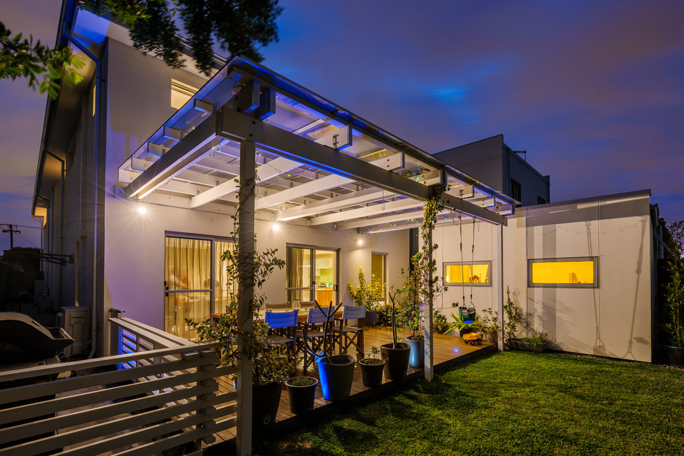 Inspiration for a small contemporary backyard deck in Perth with a pergola.