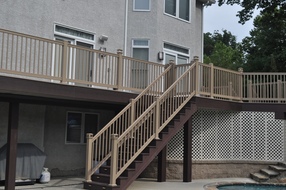 Deck - mid-sized transitional backyard deck idea with no cover