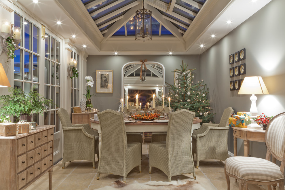 This is an example of a large traditional sunroom in Other with a skylight and beige floor.