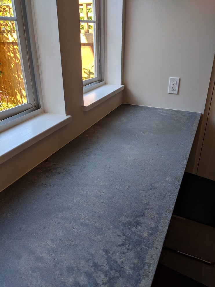 Small transitional u-shaped vinyl floor and beige floor eat-in kitchen photo in Vancouver with a single-bowl sink, shaker cabinets, white cabinets, quartz countertops, gray backsplash, ceramic backsplash, stainless steel appliances, no island and gray countertops