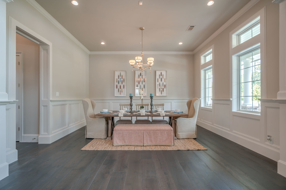 Inspiration for a large beach style separate dining room in Houston with beige walls, dark hardwood floors, no fireplace, brown floor and decorative wall panelling.