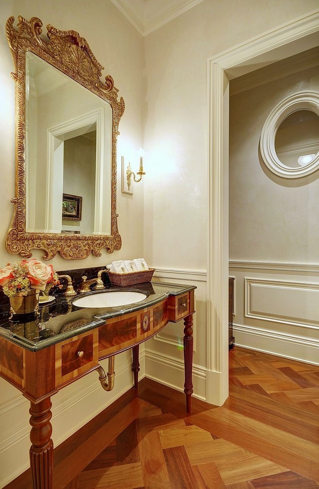 This is an example of a traditional powder room in Miami.
