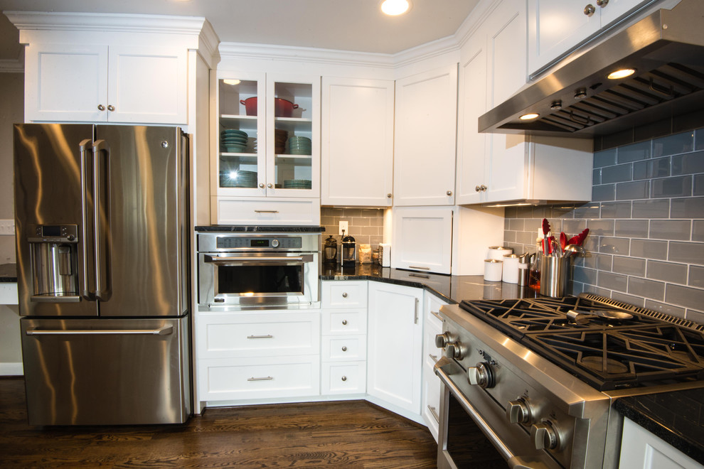 Transitional kitchen photo in Baltimore with white cabinets, gray backsplash, glass tile backsplash, stainless steel appliances and no island