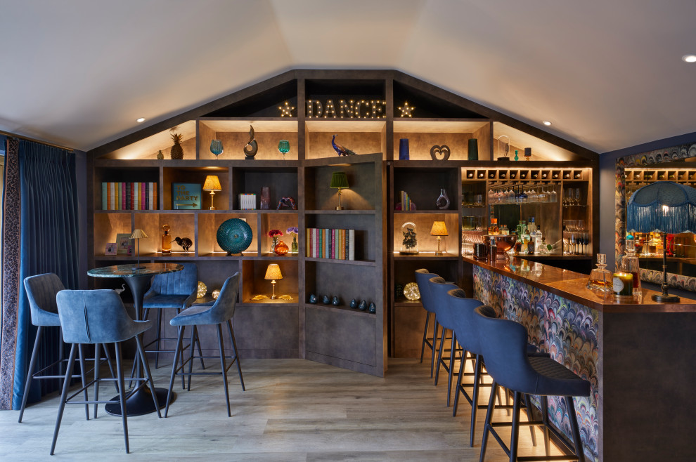 Photo of a medium sized eclectic home bar in Surrey.