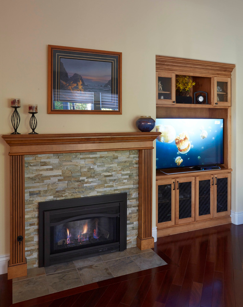 Photo of a mid-sized arts and crafts open concept family room in San Francisco with a game room, beige walls, medium hardwood floors, a standard fireplace, a stone fireplace surround and a built-in media wall.