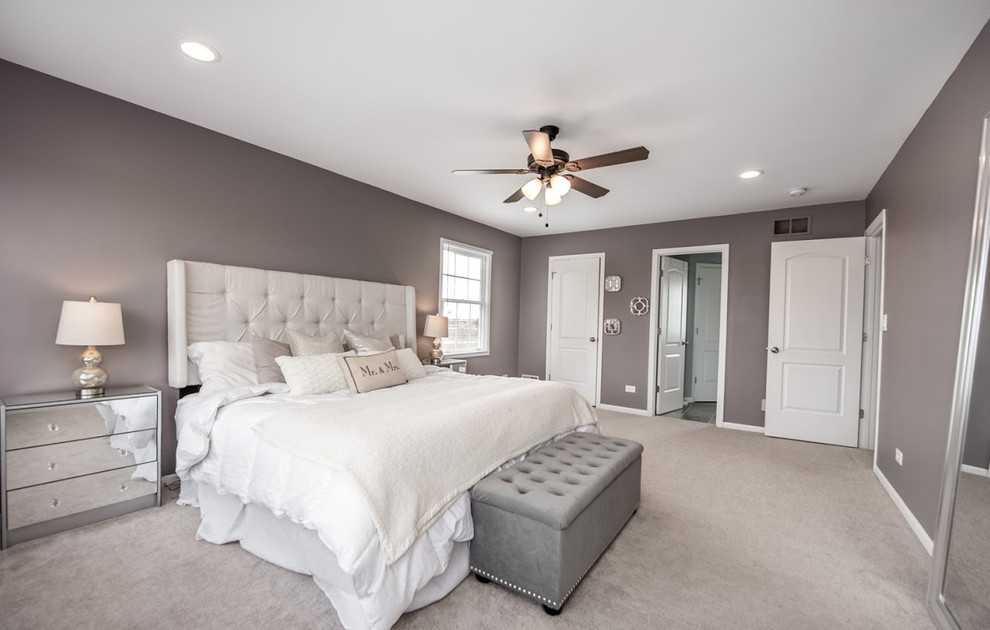 Large transitional master bedroom in Chicago with grey walls, carpet, no fireplace and grey floor.