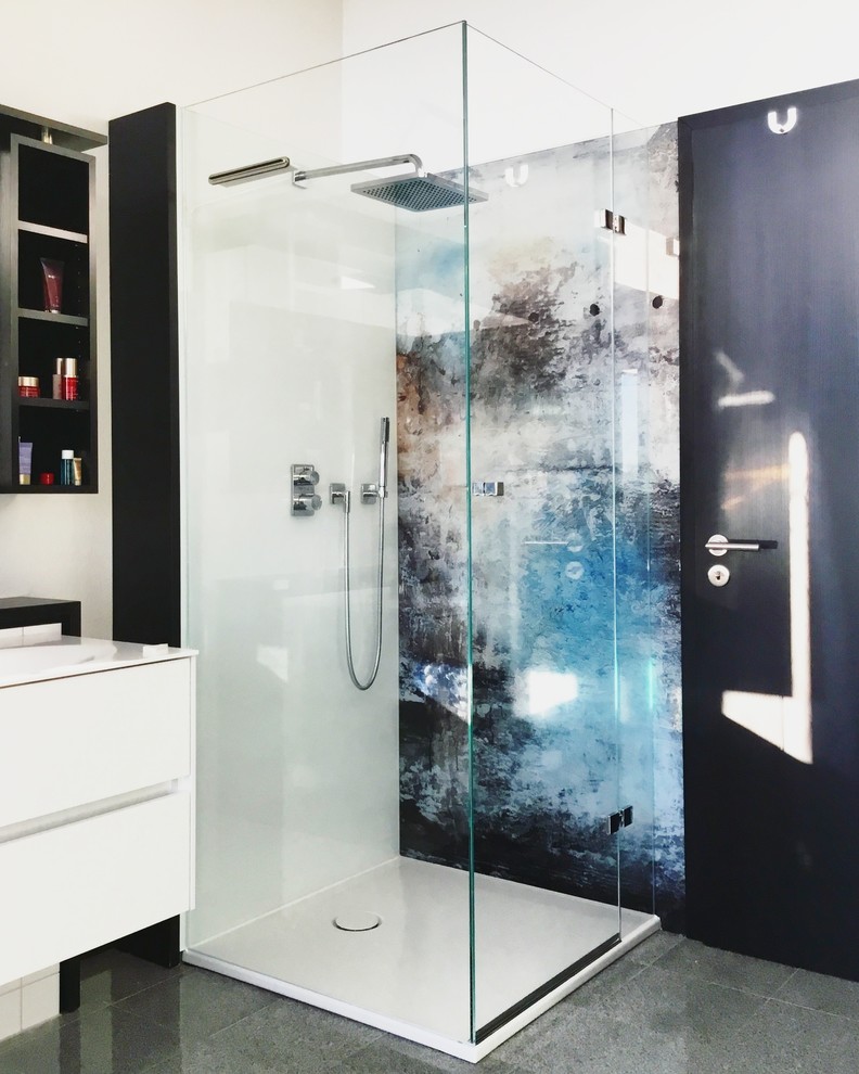 Photo of a mid-sized contemporary 3/4 bathroom in Hanover with flat-panel cabinets, white cabinets, a corner shower, an integrated sink, grey floor and a hinged shower door.