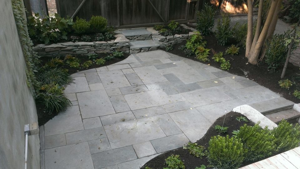 Design ideas for a small contemporary backyard shaded garden in Philadelphia with natural stone pavers.