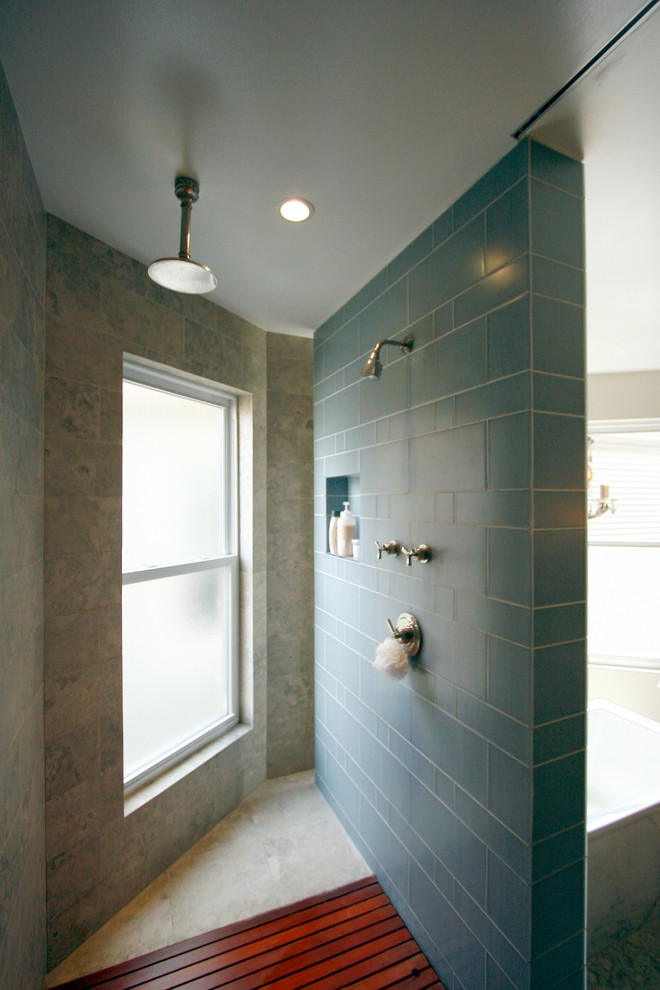 Photo of a mid-sized contemporary master bathroom in Chicago with an open shower, a drop-in tub, blue tile, ceramic tile, beige walls, marble floors and an open shower.