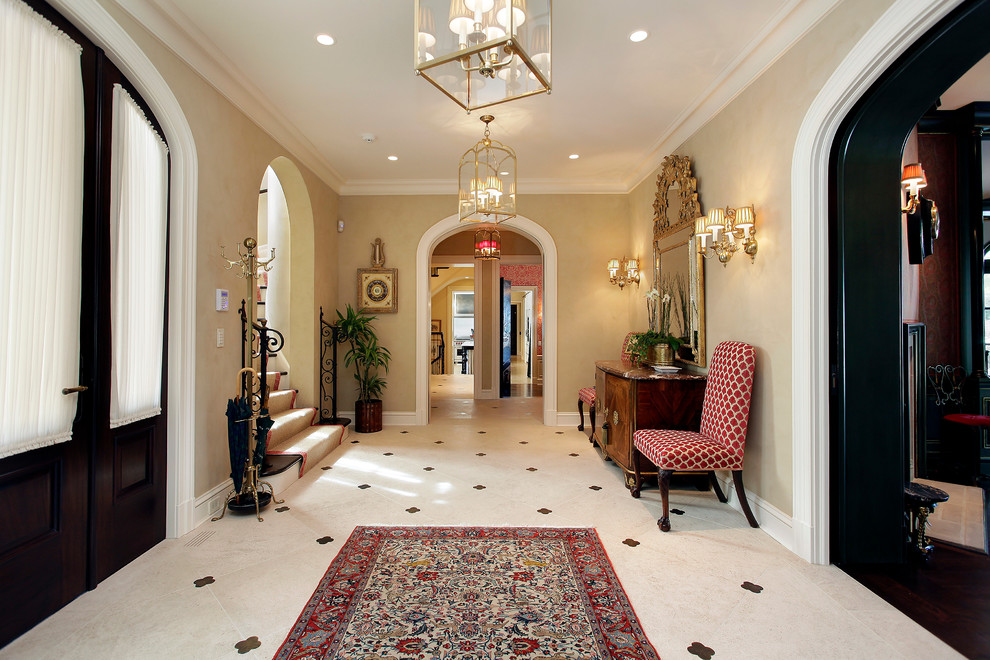 Design ideas for a mediterranean entry hall in Chicago with beige walls.