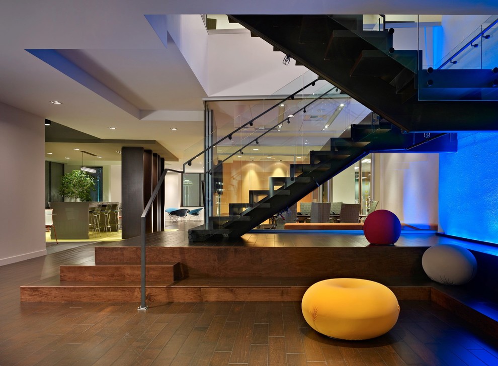 Photo of a large contemporary foyer in Salt Lake City with beige walls and medium hardwood floors.