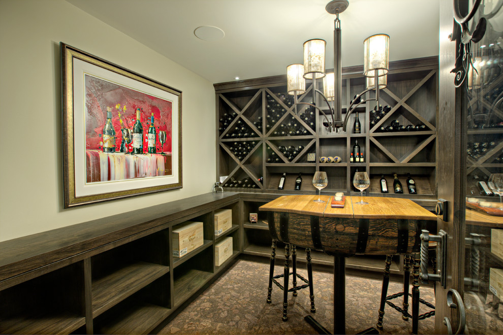 Inspiration for a transitional wine cellar in Calgary with diamond bins.