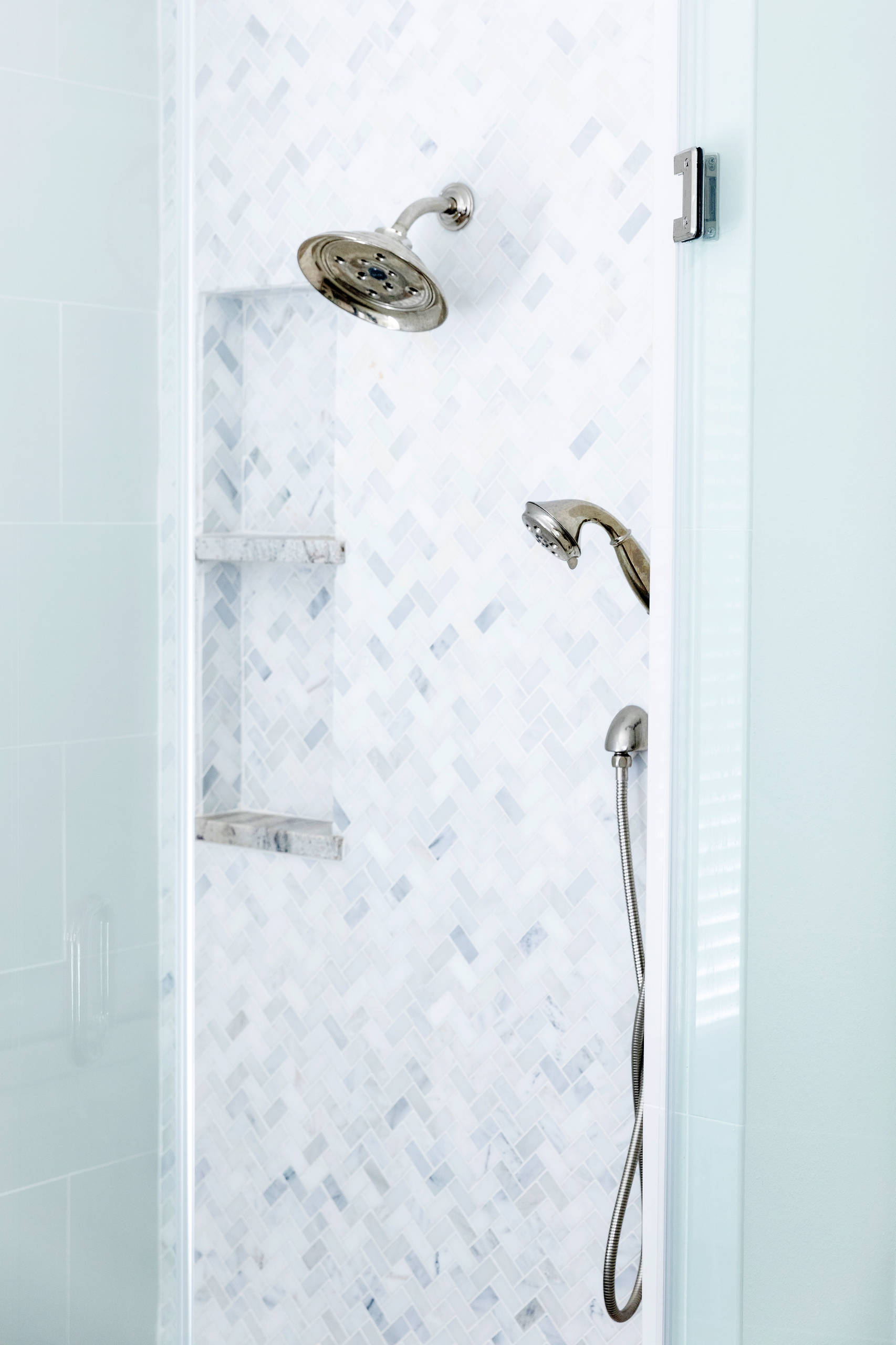 Entrance to shower. Chrome shower head. Floor to ceiling tile. Space Planning by Ourso Designs. Photo by Collin Richie (Collin Richie Photography).