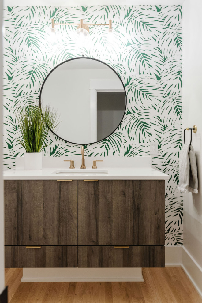 Inspiration for a mid-sized modern powder room remodel in Omaha with distressed cabinets and green walls