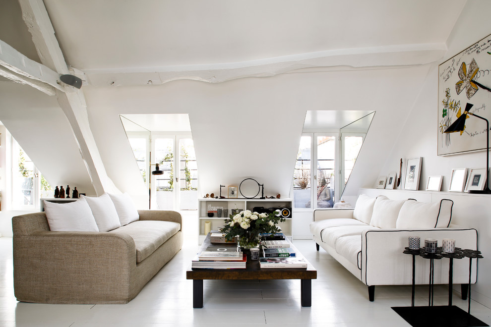 This is an example of a large scandinavian formal living room in Paris with white walls, painted wood floors, no fireplace and no tv.