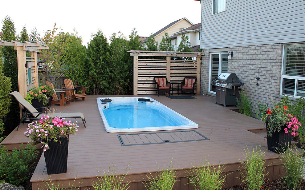 Design ideas for a mid-sized arts and crafts backyard shaded garden for summer in Toronto with decking.