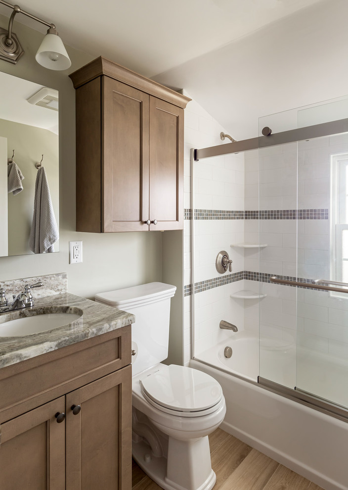 Design ideas for a small traditional master bathroom in Boston with shaker cabinets, beige cabinets, an alcove tub, an alcove shower, a two-piece toilet, white tile, subway tile, porcelain floors, an undermount sink, quartzite benchtops, a sliding shower screen and green benchtops.