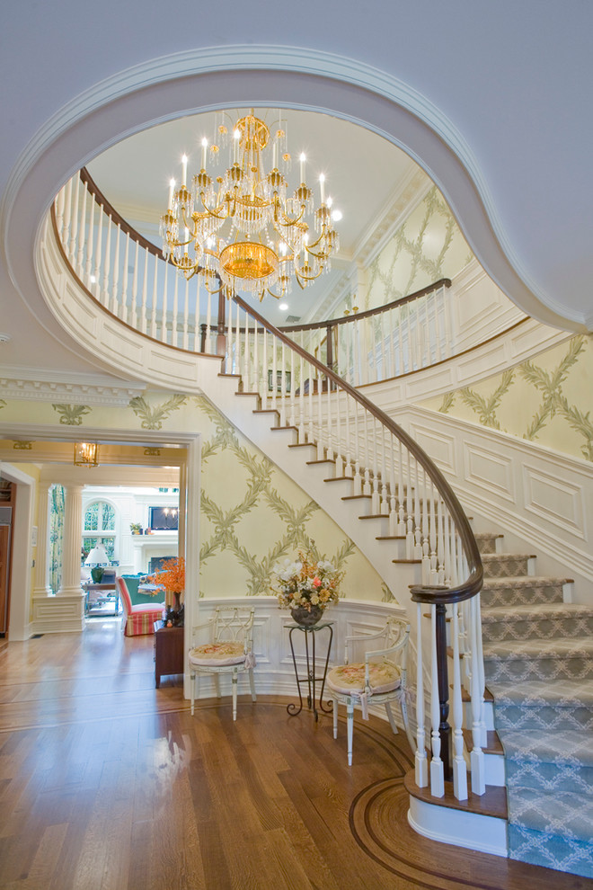 Inspiration for a traditional wood curved staircase in New York.