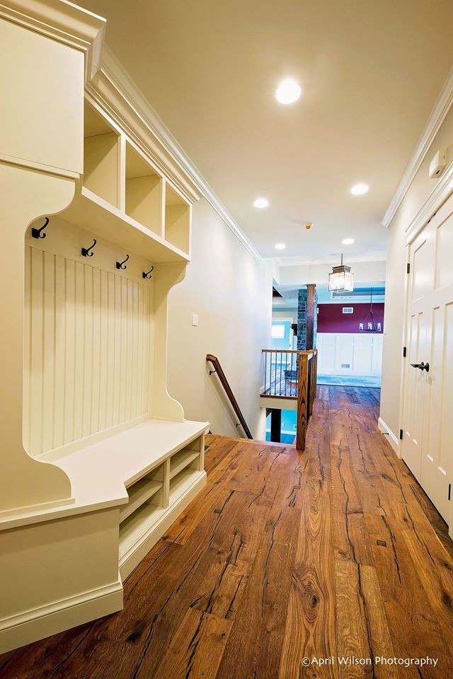 Inspiration for a large country hallway in Philadelphia with beige walls and medium hardwood floors.