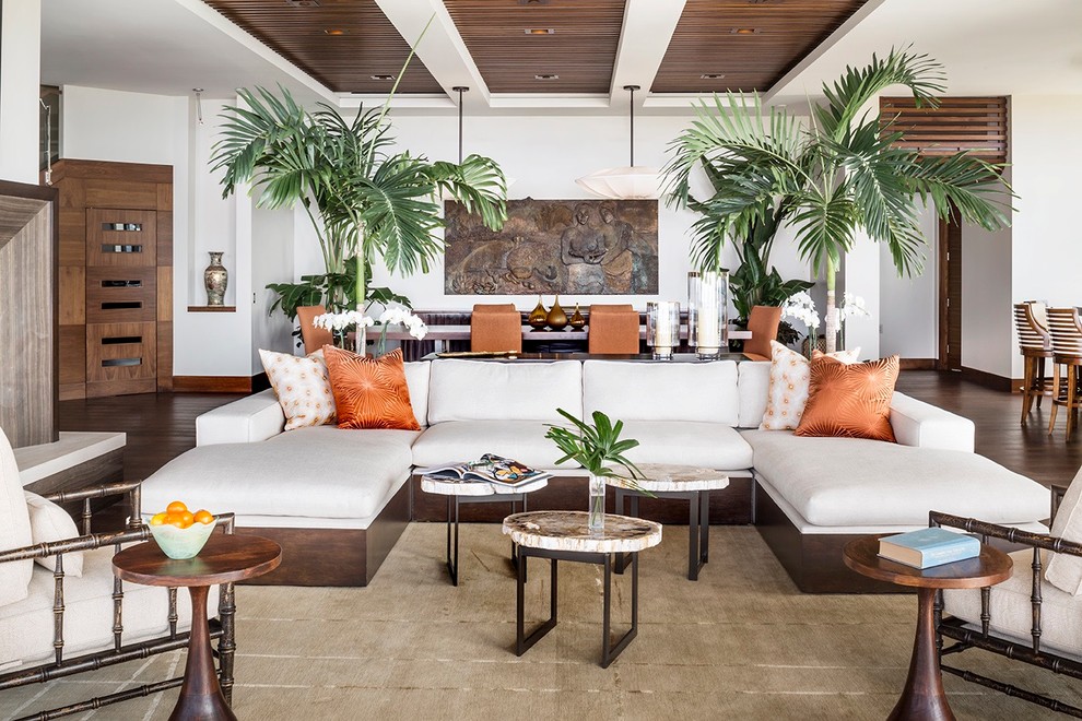 Large tropical formal open concept living room in Orange County with beige walls, ceramic floors, a standard fireplace, a stone fireplace surround and no tv.