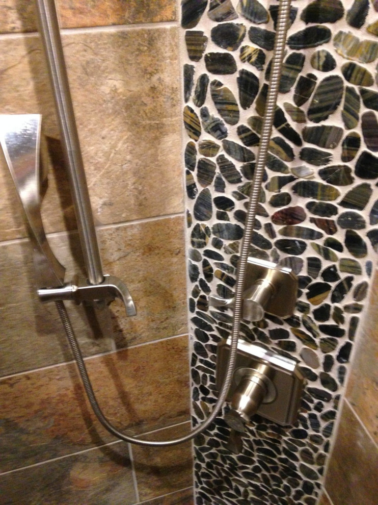 Example of a mountain style beige tile and porcelain tile bathroom design in Little Rock