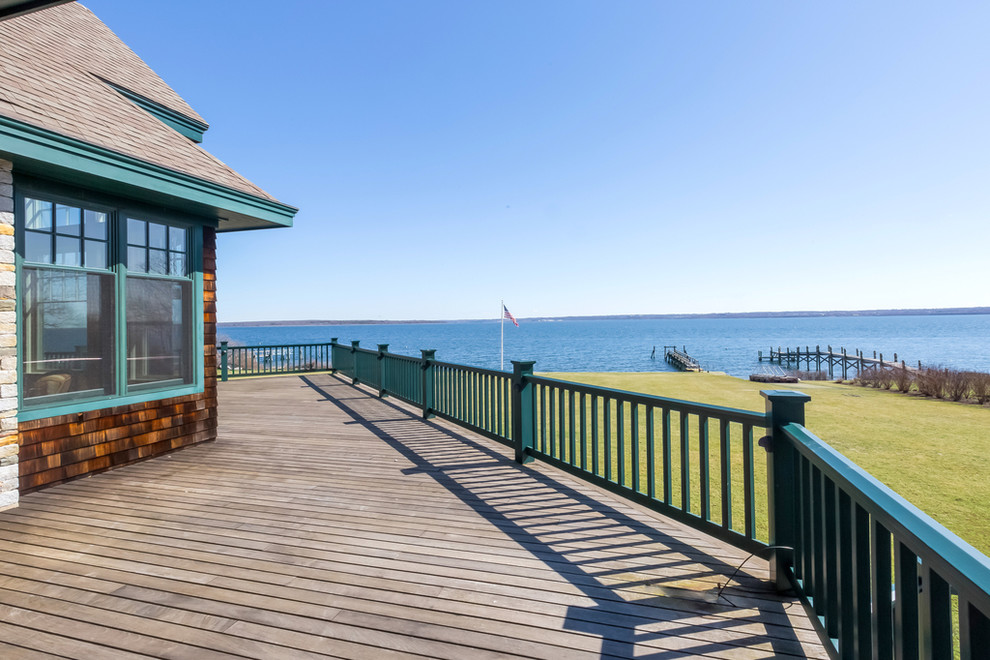 Inspiration for a huge craftsman backyard deck remodel in Providence with no cover