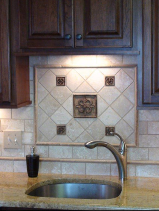 Example of a transitional kitchen design with raised-panel cabinets, dark wood cabinets and beige backsplash