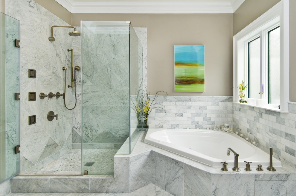 Transitional bathroom in San Francisco with a corner tub and stone tile.