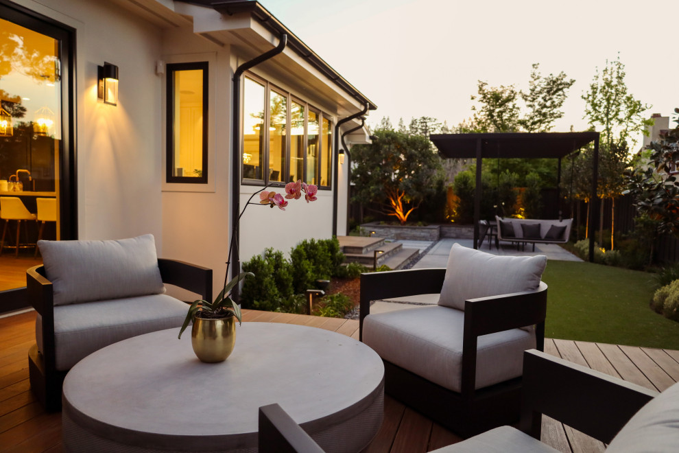 Contemporary backyard and ground level deck in San Francisco with with skirting and a pergola.