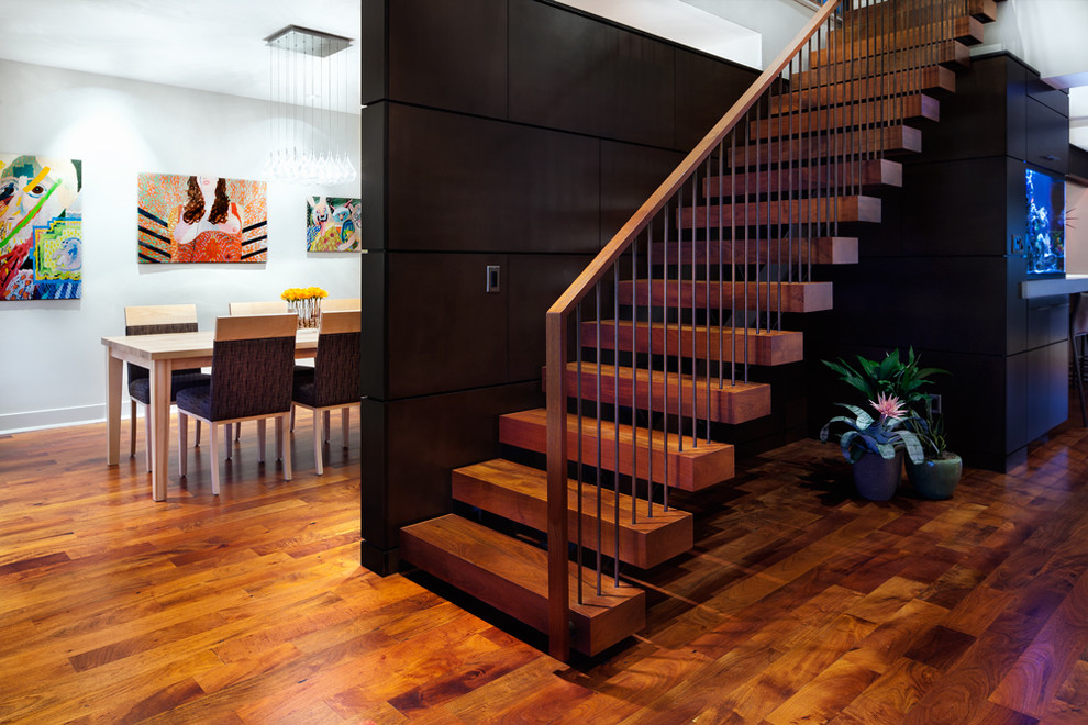 Inspiration for a large contemporary wood floating staircase in Austin with open risers and mixed railing.