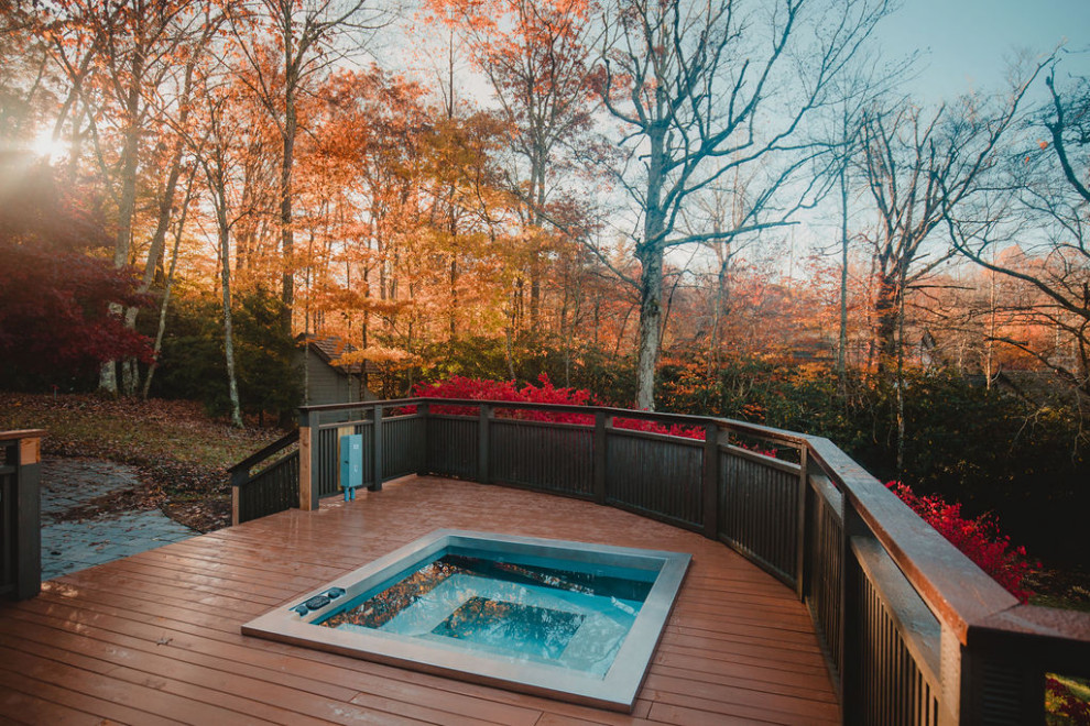 Design ideas for a small country backyard rectangular aboveground pool in Other with a hot tub and decking.