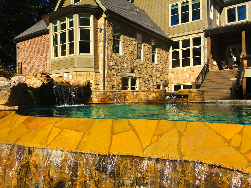 Example of a mountain style home design design in Atlanta