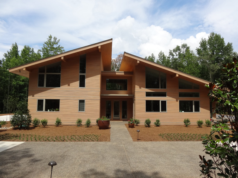 Design ideas for a modern exterior in Raleigh with wood siding.