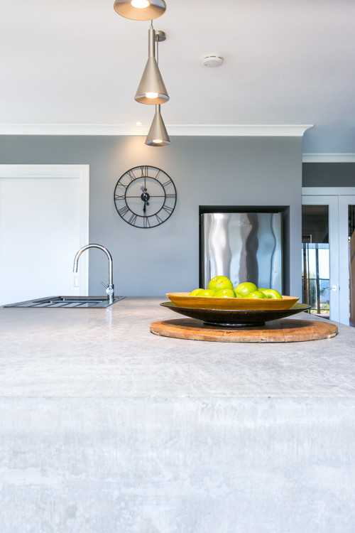 Expansive contemporary galley eat-in kitchen in Melbourne with a double-bowl sink, open cabinets, white cabinets, concrete benchtops, white splashback, subway tile splashback, stainless steel appliances and with island.