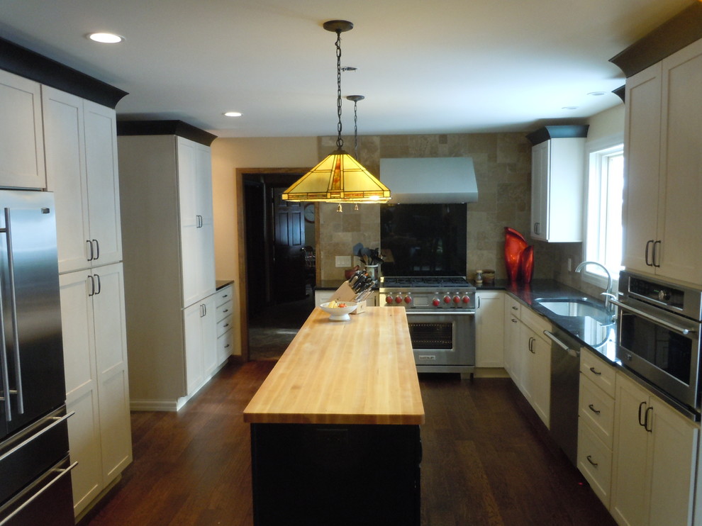 Design ideas for a transitional kitchen in St Louis with granite benchtops and beige splashback.