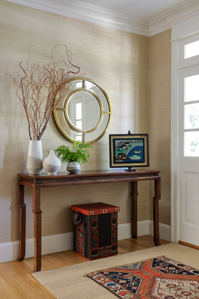 Inspiration for a mid-sized transitional medium tone wood floor and wallpaper foyer remodel in Boston with a white front door