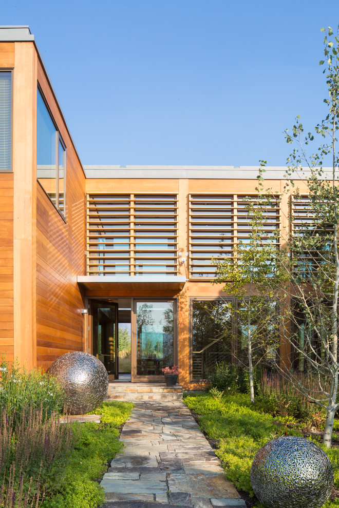 Design ideas for a modern exterior in Denver with wood siding.
