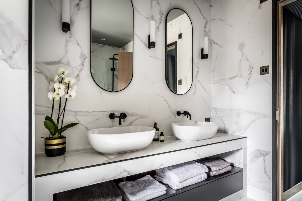 Inspiration for a contemporary ensuite bathroom in London with flat-panel cabinets, grey cabinets, an alcove shower, grey tiles, white tiles, marble tiles, marble flooring, a vessel sink, marble worktops, multi-coloured floors, multi-coloured worktops, double sinks and a built in vanity unit.