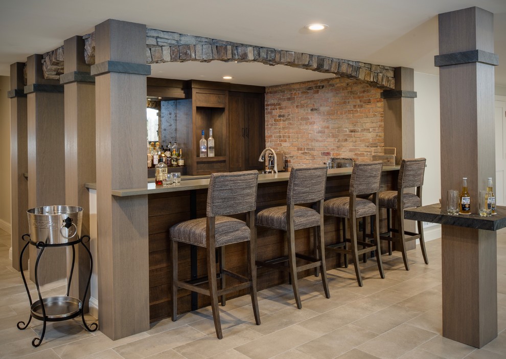 This is an example of a large industrial home bar in Detroit with porcelain floors and beige floor.