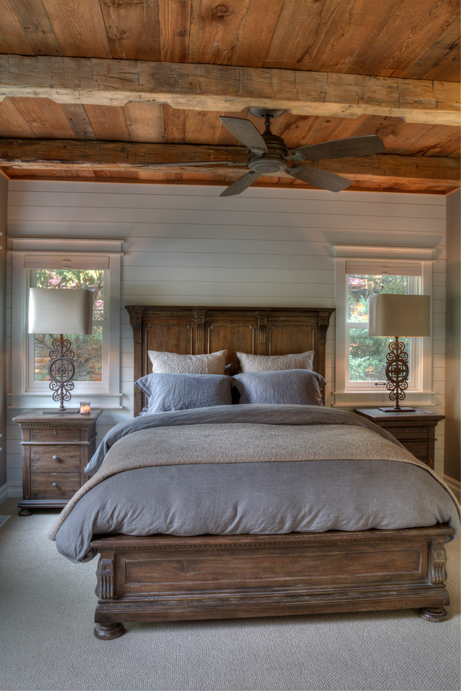Example of a mid-sized mountain style master carpeted and gray floor bedroom design in Minneapolis with white walls