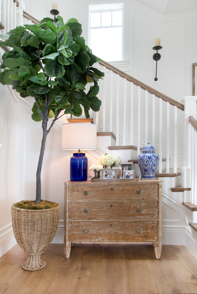Beach style wood l-shaped staircase in Orange County with wood risers.