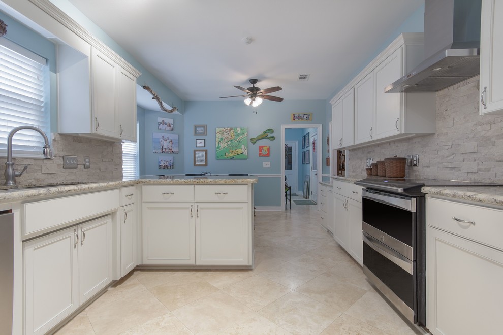 Example of a large transitional galley eat-in kitchen design in Miami with flat-panel cabinets and white cabinets