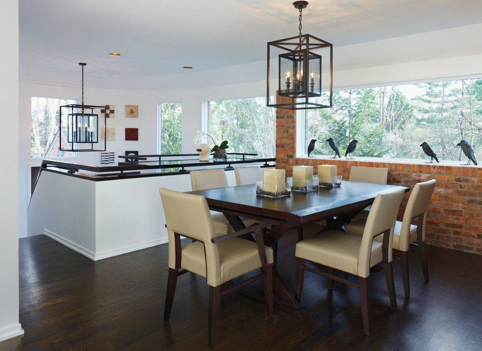 Inspiration for a contemporary dining room in Detroit with white walls and dark hardwood floors.